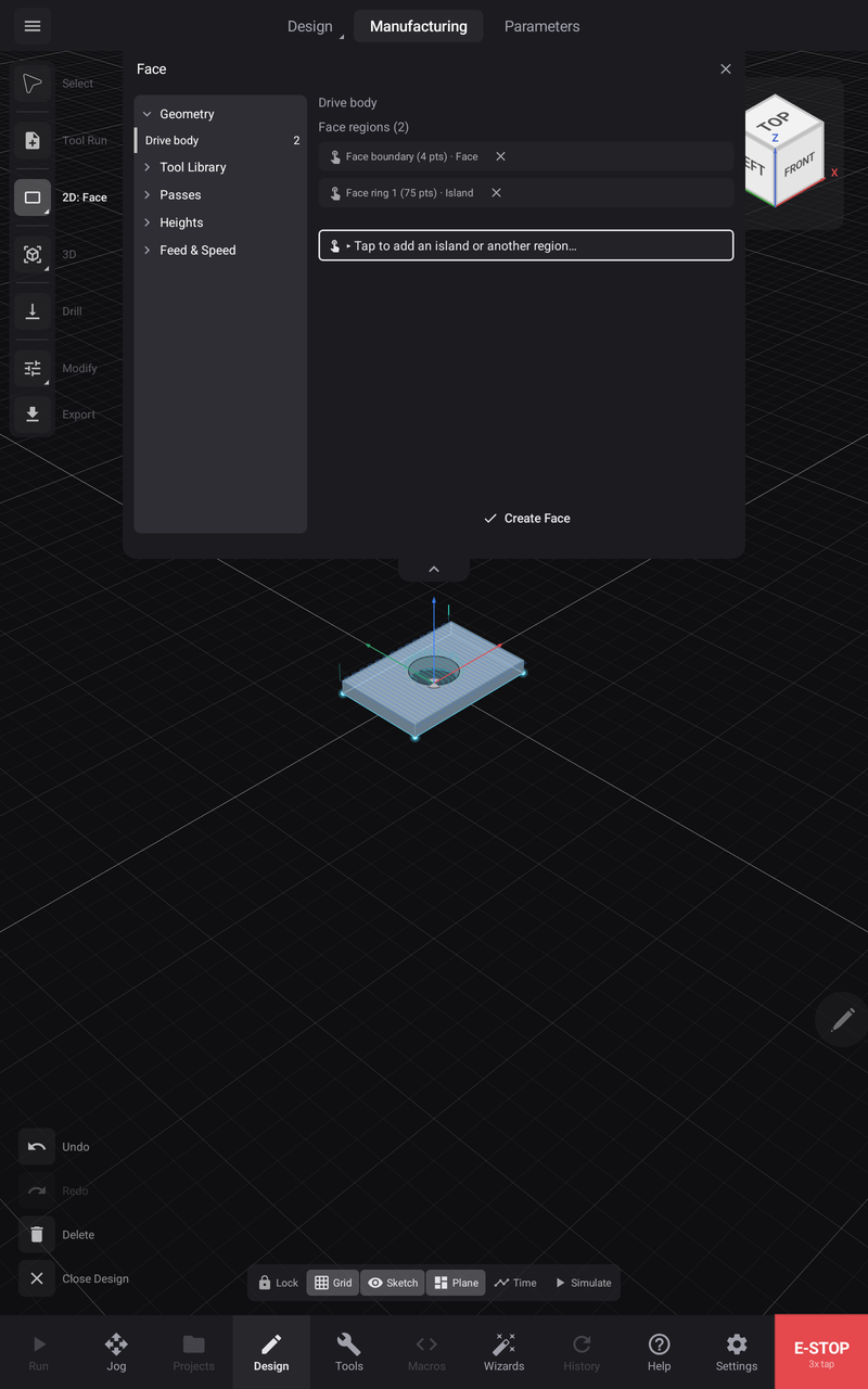 A 2D operation armed — the Face panel over the Manufacturing workspace, with the picked face hatched on the body