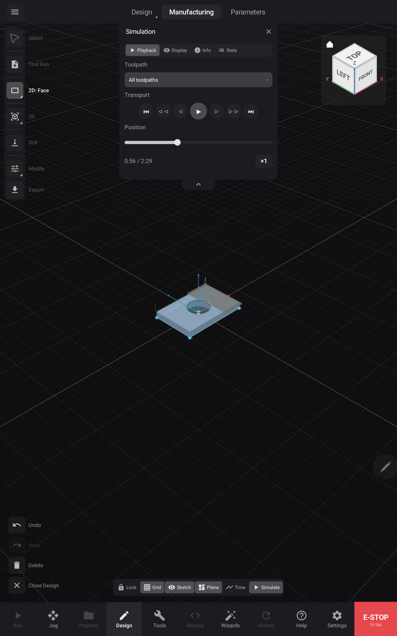 A facing pass mid-simulation — machined material behind the cutter, untouched stock ahead of it