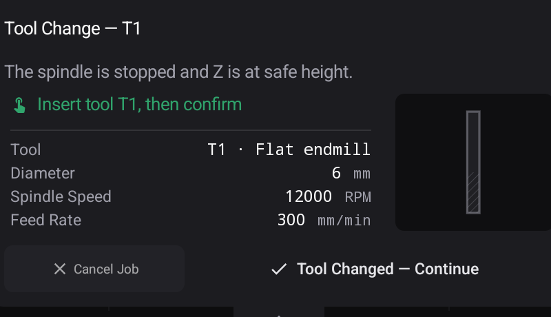The tool-change stop — the tool the program asks for, its cutting numbers, and the two ways out